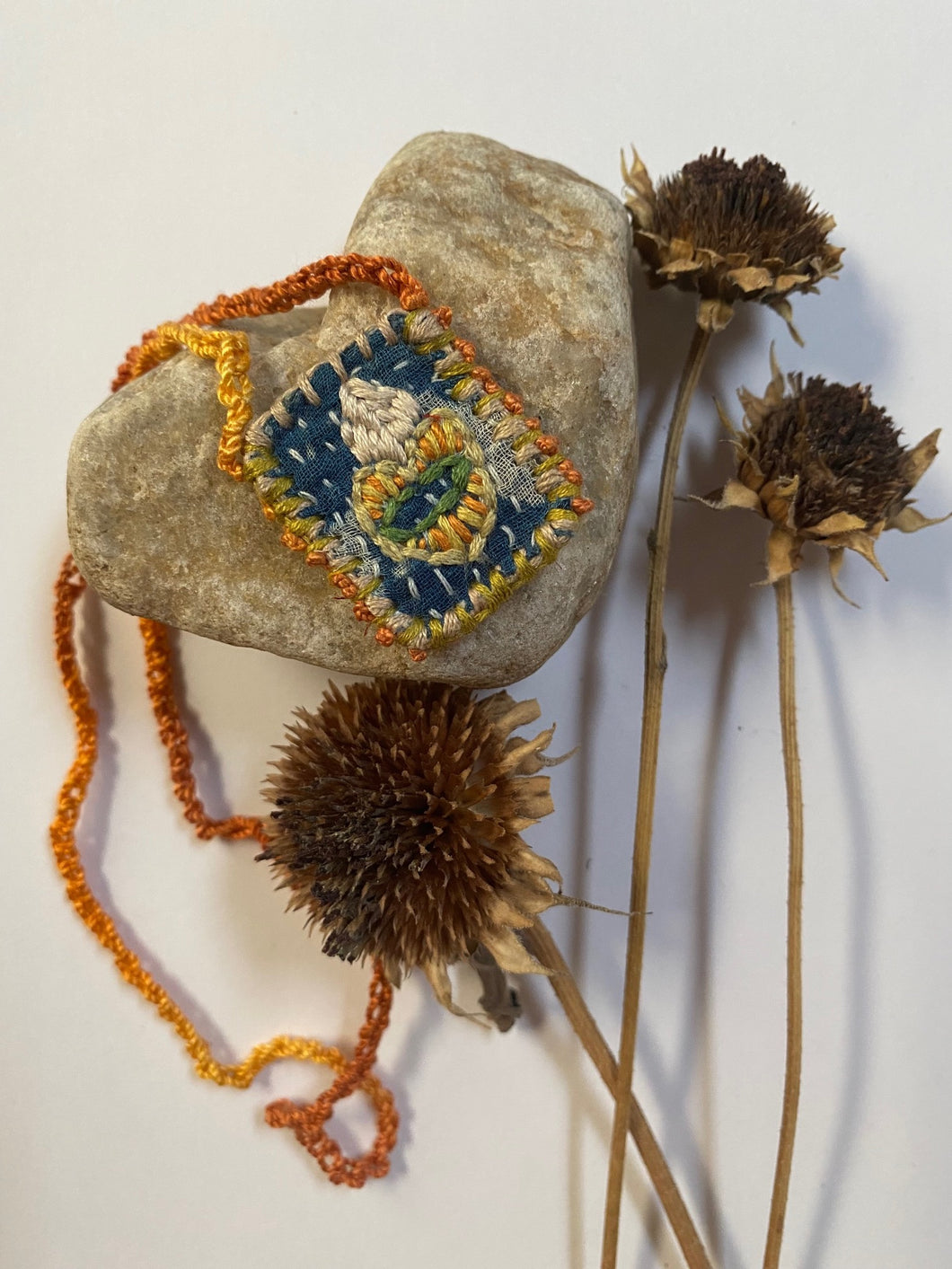Embroidered heart pouch necklace
